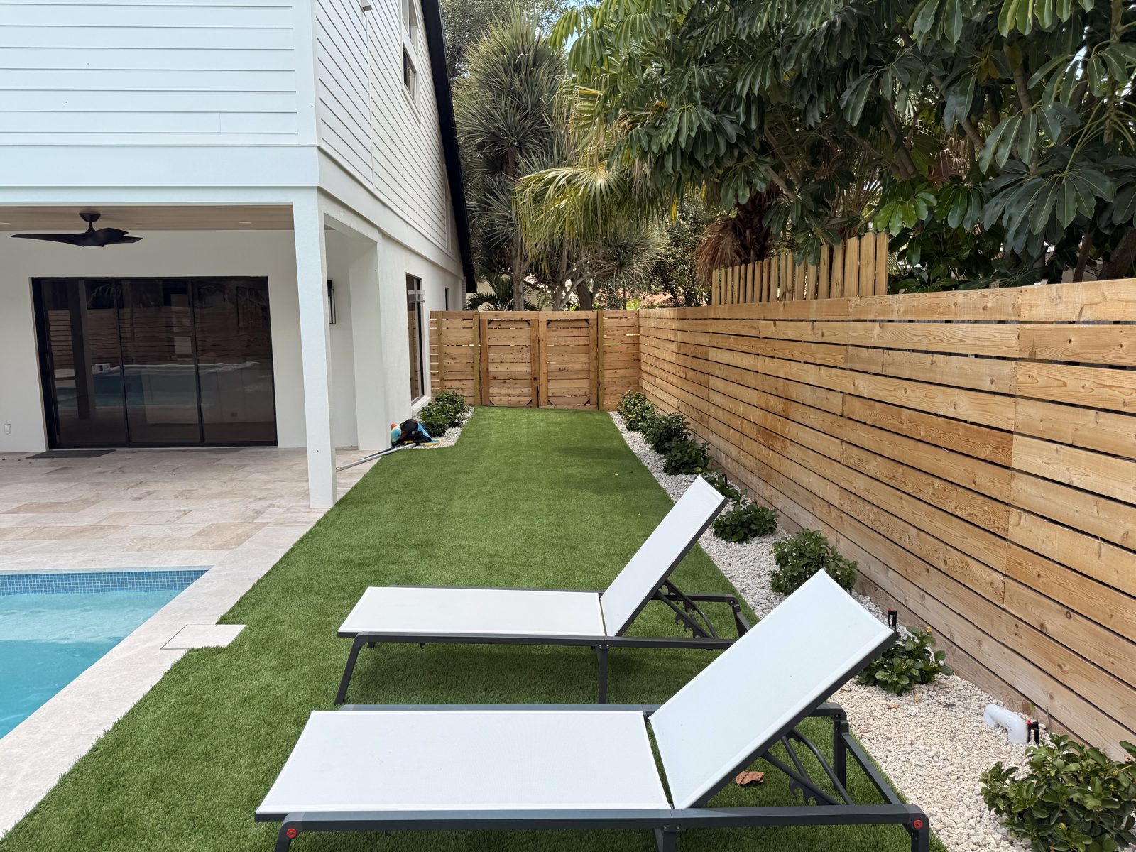 Custom horizontal wood privacy fence around a pool in Sarasota